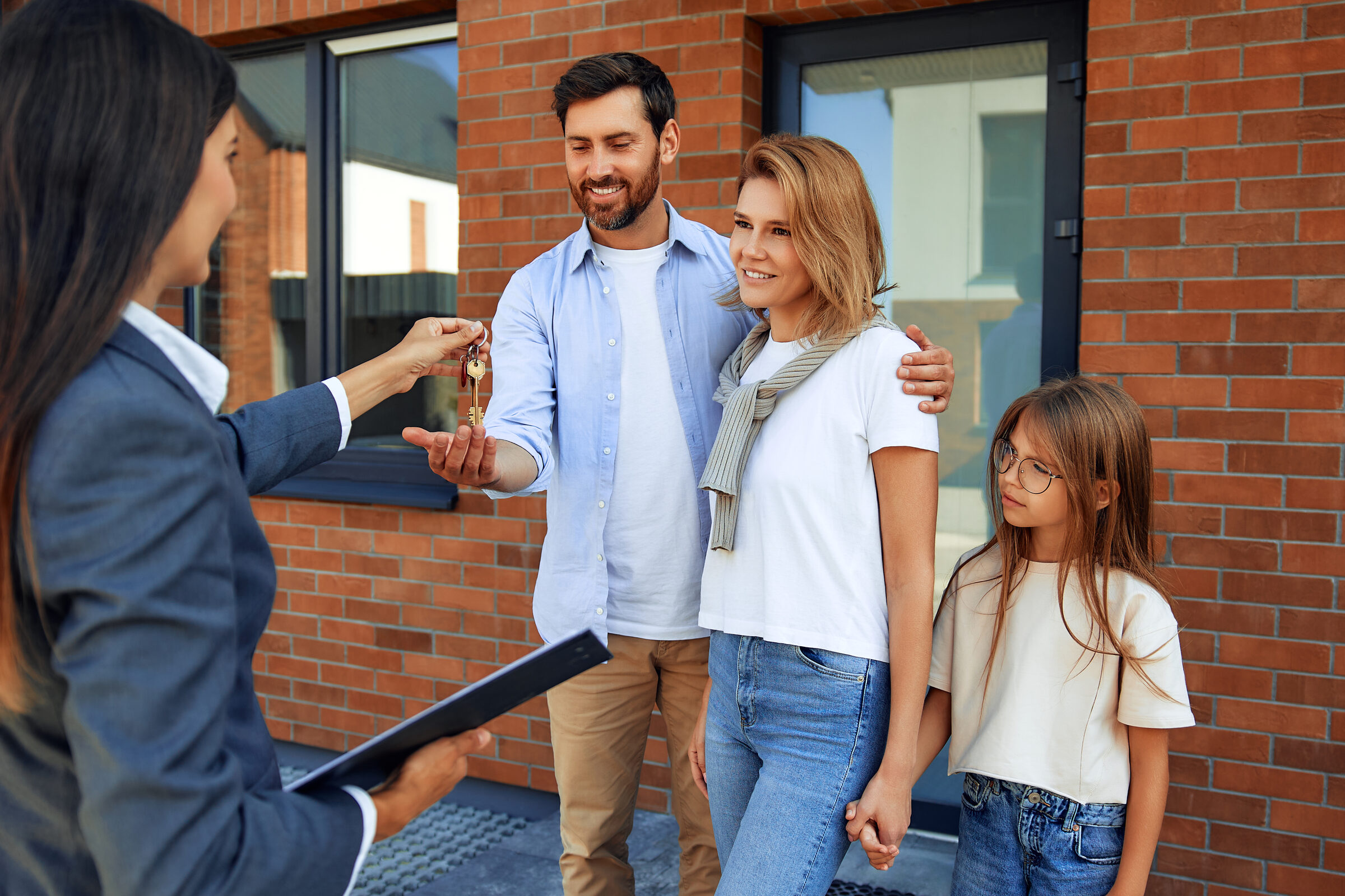 Family receiving the keys to their new home